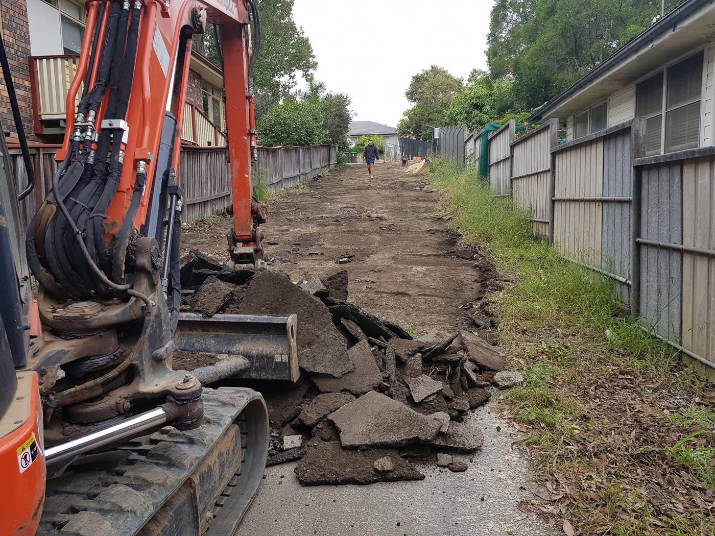 Excavator removing an old driveway for replacement, Sydney