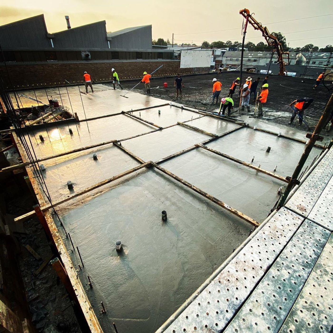 Masta Concrete crew finishing a large engineered slab pour on a Sydney site