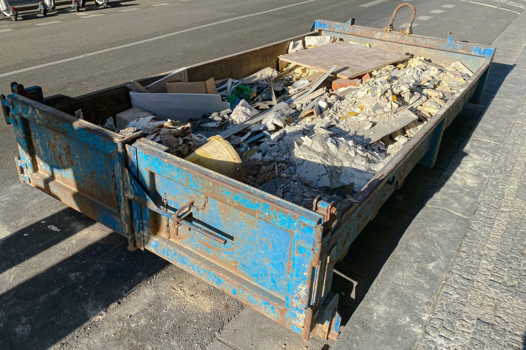 Metal,Dumpster,Waste,Container,Filled,With,Construction,Waste,,Rubble,Near